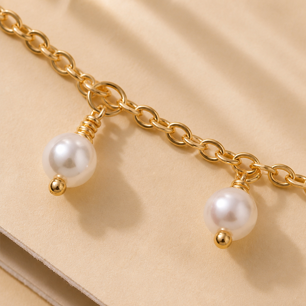 RadianceAura™ – Layered Gold-Plated Bracelet Set Featuring Pearl & Laurel Accents