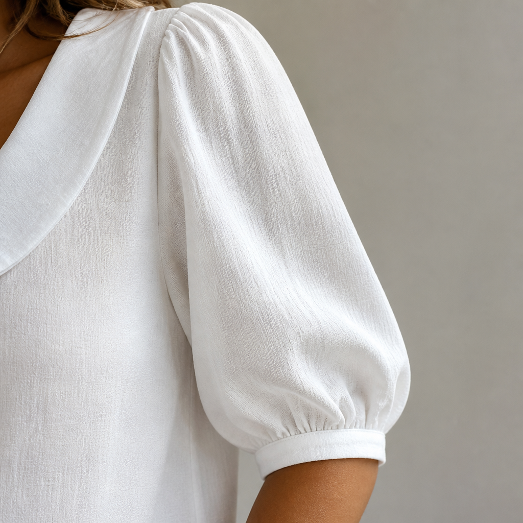 LuminaLuxe™ – Gentle Peter Pan Collar Short-Sleeve Blouse