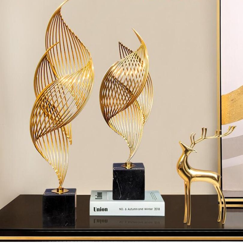 Fluid Elegance: Contemporary Gold Metal Art Piece