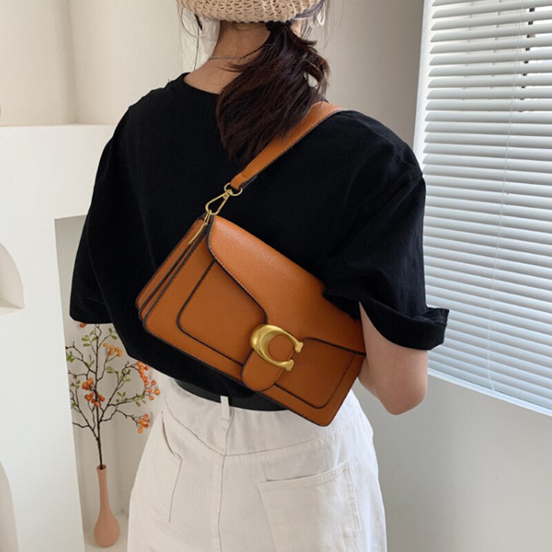 Chic Eco-Friendly Handbag with Elegant Gold and Brown Accents