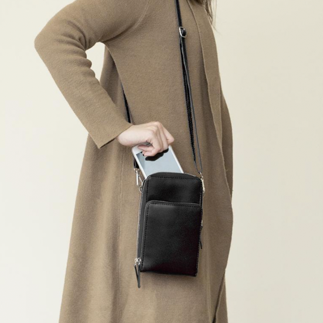 Chic Leather Phone Clutch with Safety Features and Adjustable Strap