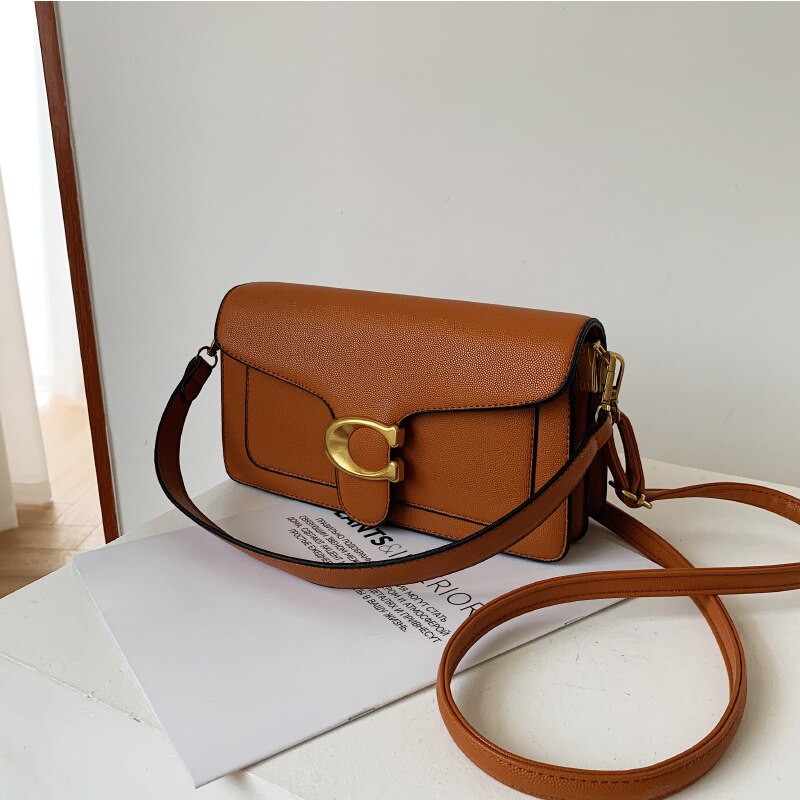 Chic Eco-Friendly Handbag with Elegant Gold and Brown Accents