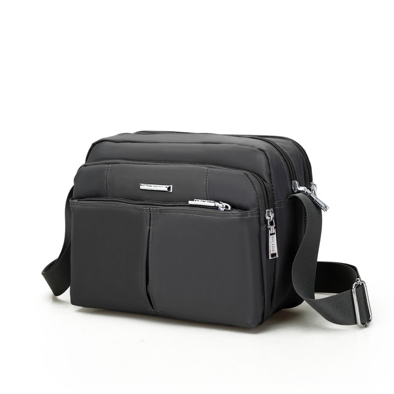 Water-Resistant Multi-Compartment Crossbody Bag with Adjustable Strap